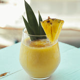 A glass of pina colada. Pina Colada fragrance oil for soap and candle making. Scentivore wholesale supply.