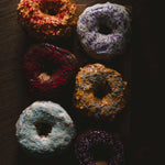 Assorted donuts on the table. Campfire Donuts fragrance oil by Scentivore. 