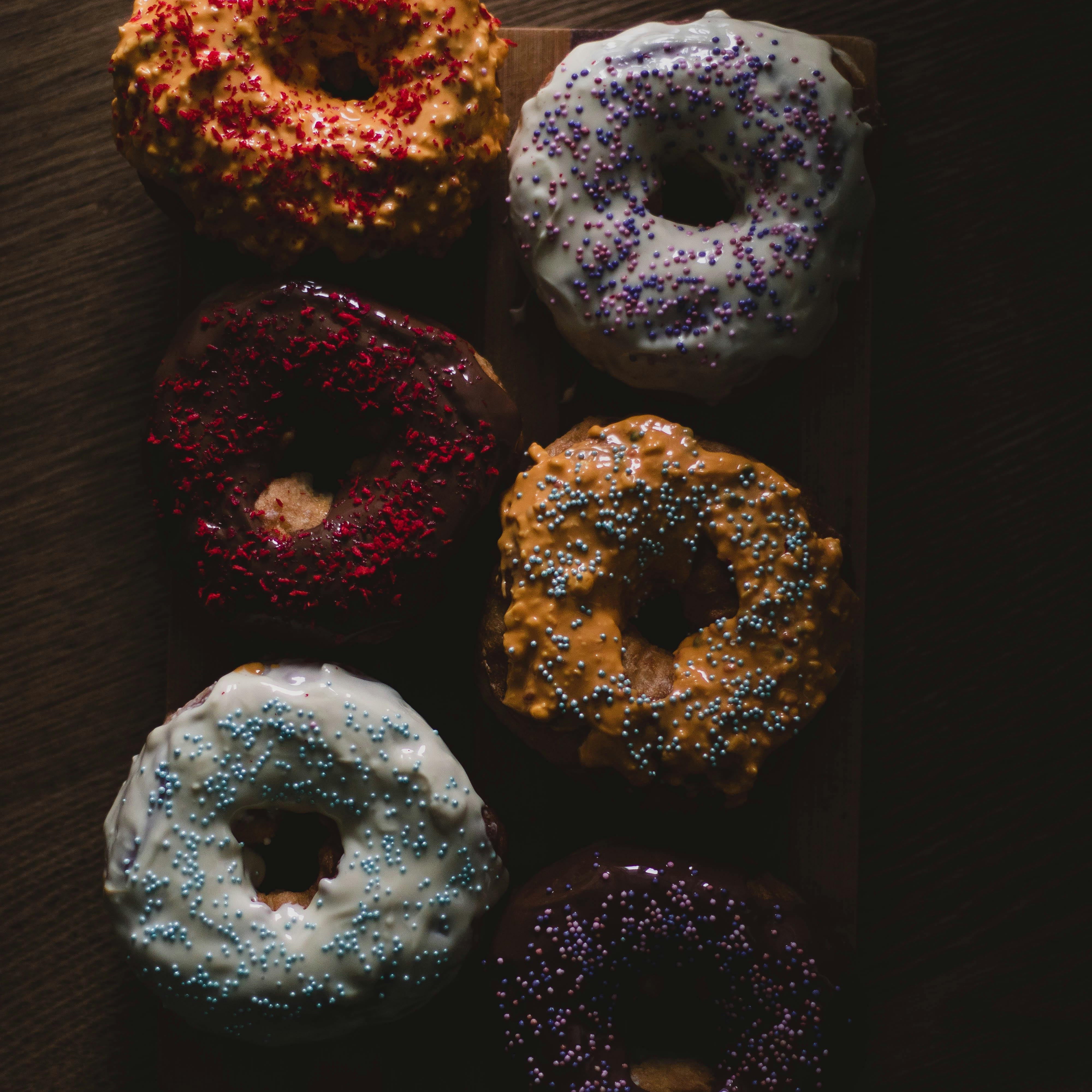 Assorted donuts on the table. Campfire Donuts fragrance oil by Scentivore. 