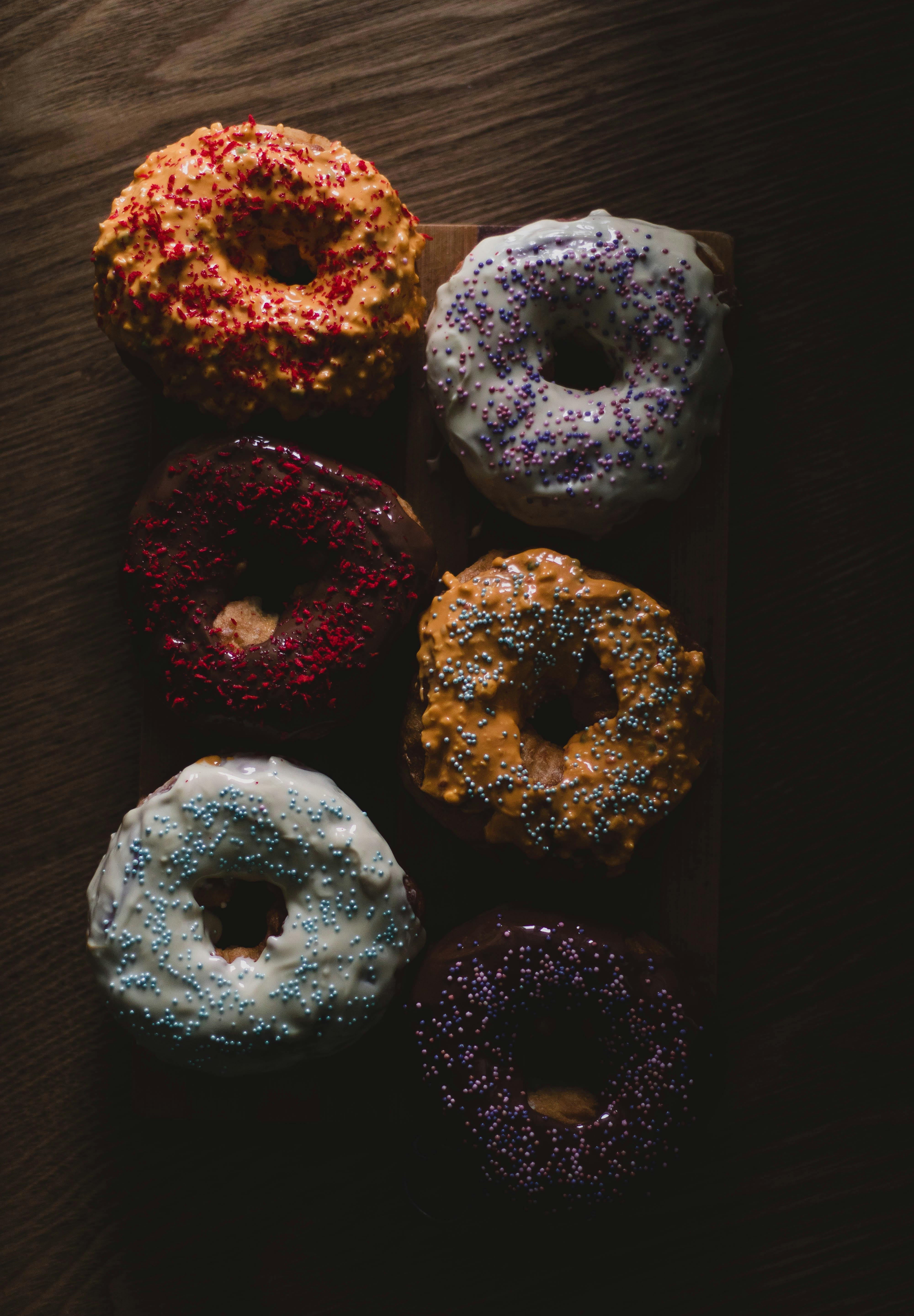 Assorted donuts on the table. Campfire Donuts fragrance oil by Scentivore. 