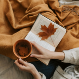 Reading a book while being tucked in a cashmere blanket. Cashmere fragrance oil by Scentivore.