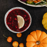 Cranberry sauce and pumpkin on the table. Cranberry Pumpkin fragrance oil for soaps and candles.