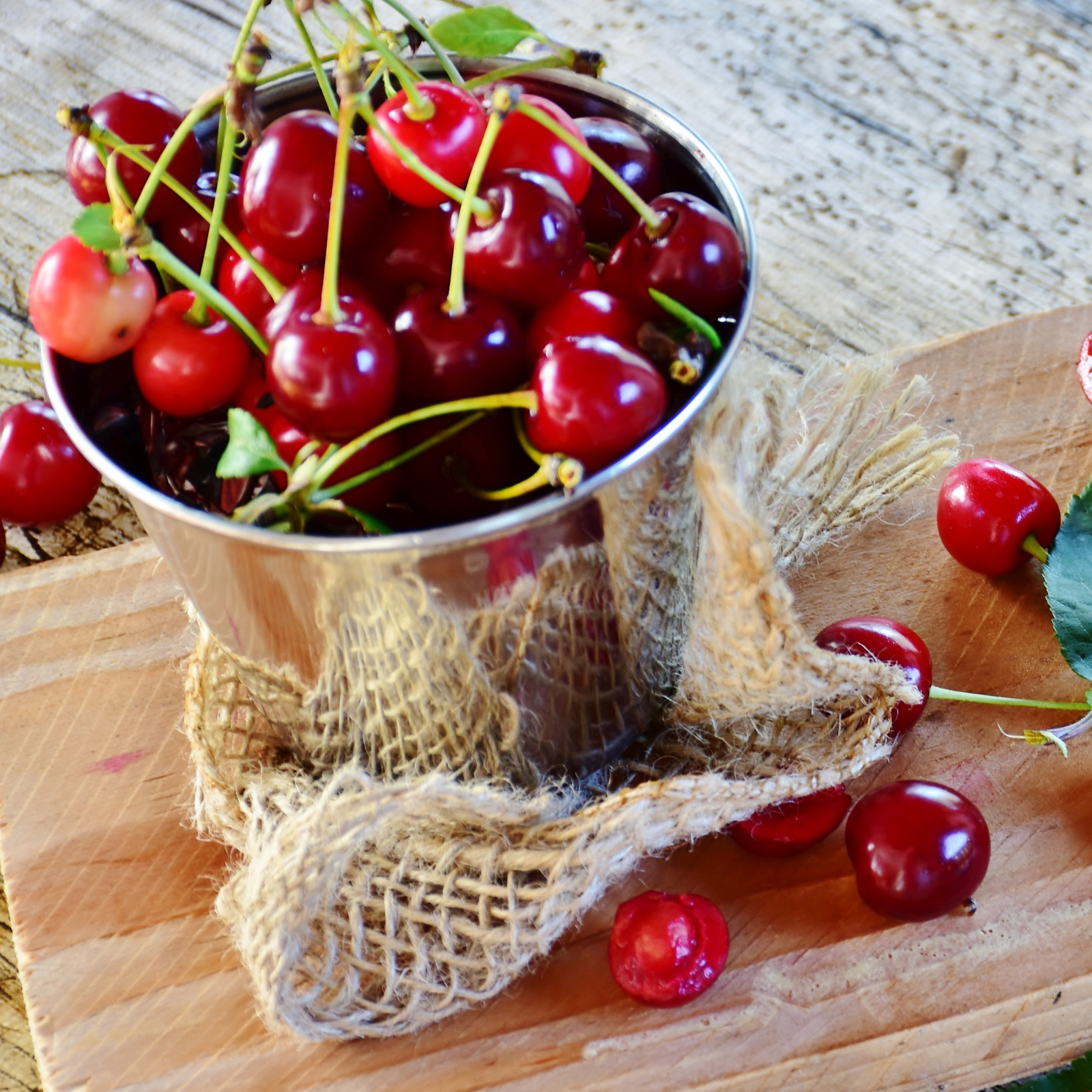 A bucket of cherries. Smoky Cherry Almond fragrance oil for soap and candle making. Scentivore fragrance.