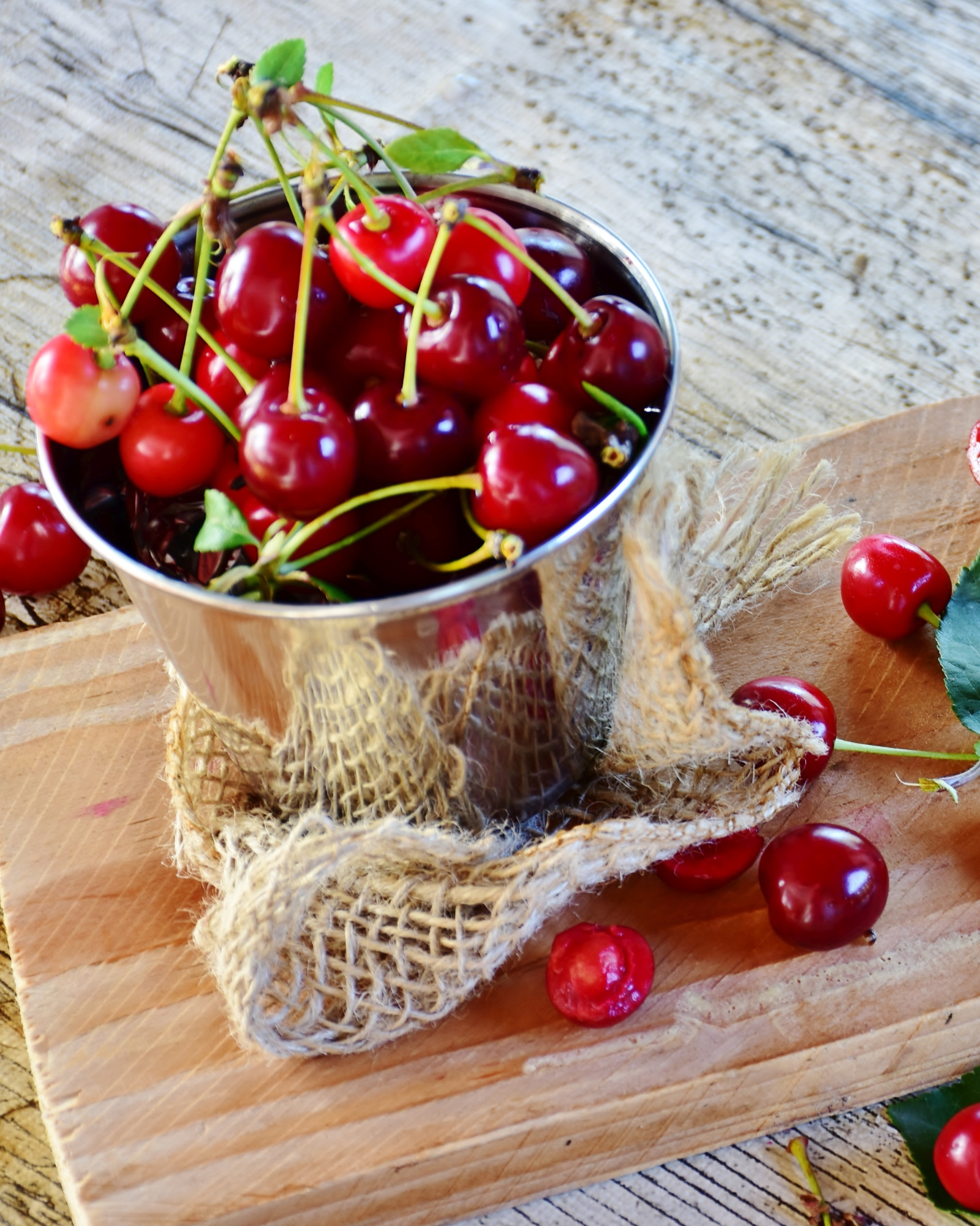 A bucket of cherries. Smoky Cherry Almond fragrance oil for soap and candle making. Scentivore fragrance.